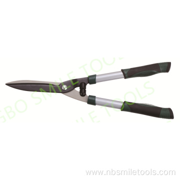 Garden flowers and trees pruning shears green lawn scissors pruning branches pruning fence shearing gardening tools